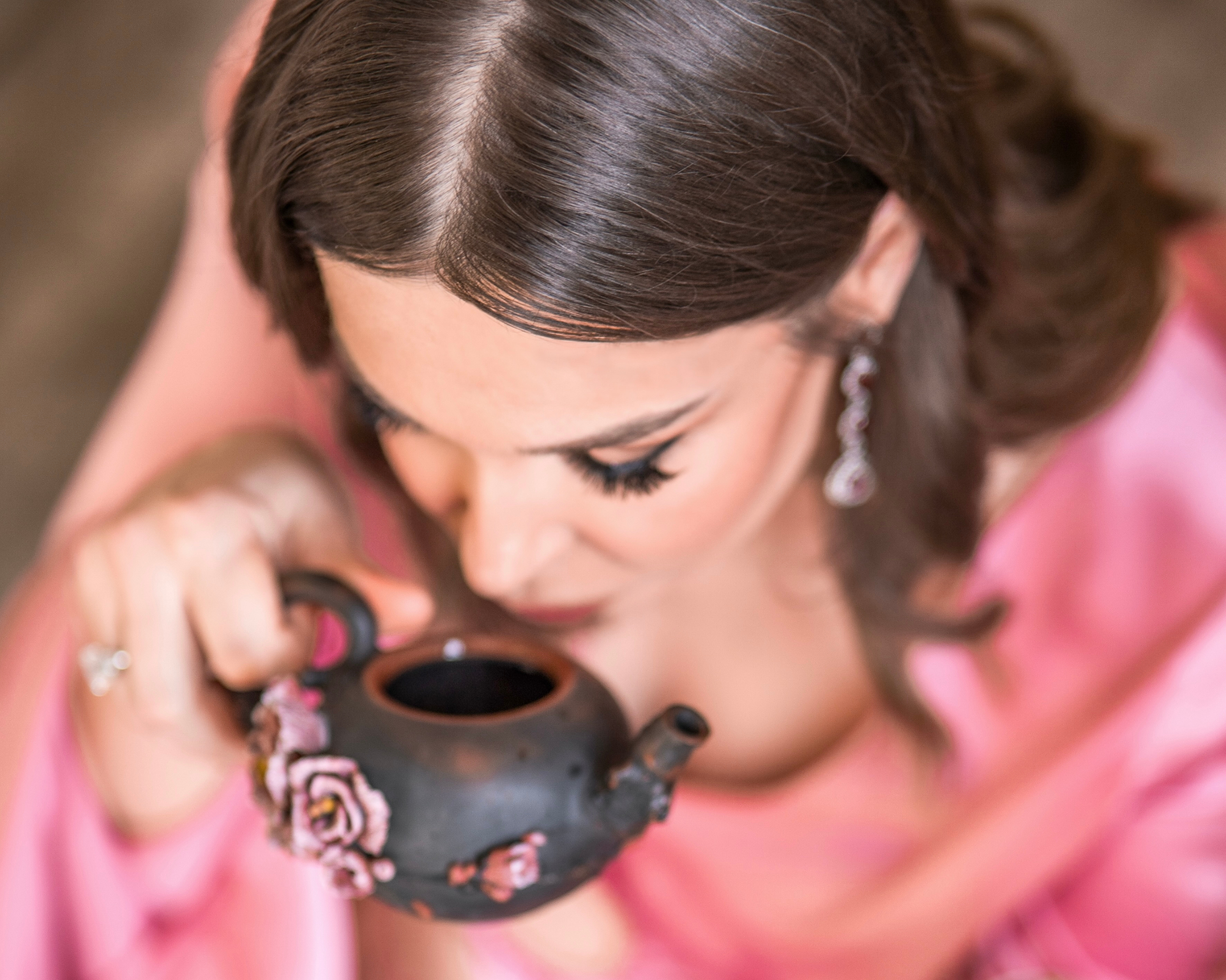 Tea Theater — ceremonial moment with rose-adorned teapot